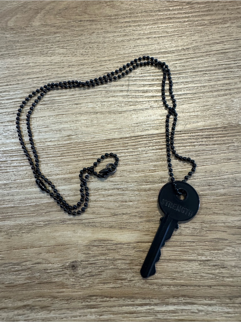 The Giving Keys Black 'STRENGTH' Key Necklace